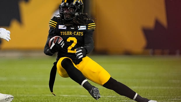 Dec 12, 2021; Hamilton, Ontario, CAN; Hamilton Tiger-Cats defensive back Tunde Adeleke (2) returns a kick against the Winnipeg Blue Bombers in the 108th Grey Cup football game at Tim Hortons Field. Mandatory Credit: John E. Sokolowski-USA TODAY Sports